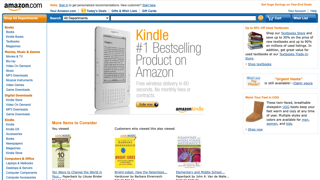 Cropped public archive screenshot of the 2010 Amazon homepage showing header search, department navigation, Kindle hero, and commerce modules.